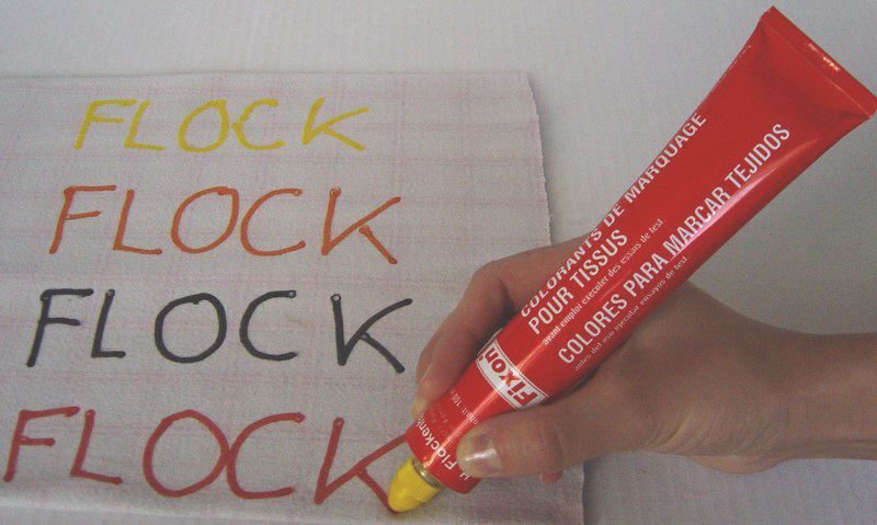 Marking fabric with a FIXON tube and writing head