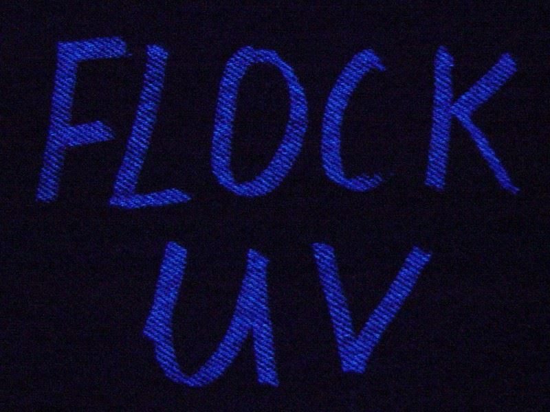 UV marking on fabric glowing under UV light